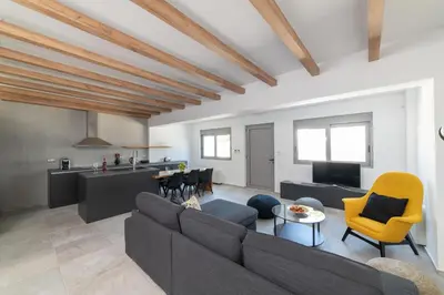 a living room with a couch and a table at Aegean Treasure Pefkos in Pefki Rhodes