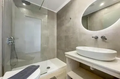 a bathroom with a white sink and a shower at Raffaello Beach in Faliraki