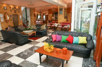a living room with a couch and a table at Arte Annapolis Inn in Rhodes Town