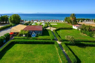 an overhead view of a park with the ocean in the background at Bayside Hotel Katsaras in Kremasti