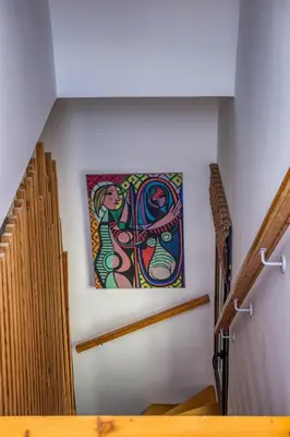 a painting on the wall of a staircase in a building at Alley 7, Old Town in Rhodes Town