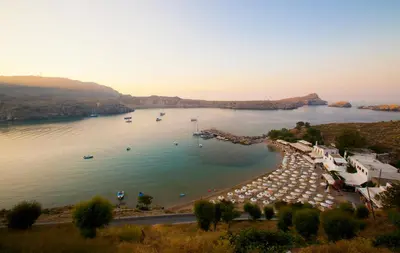 a view of a lake with boats in the water at Lindos Shore Boutique Villa with sea view in Líndos
