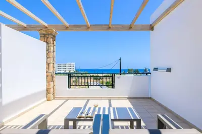 a room with tables and a view of the ocean at Villa Krini Selini in vlicha