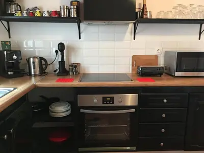 a kitchen with a stove top oven in a kitchen at Casa Kalliroi in Symi