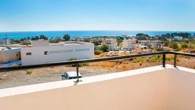 a view of a city from the balcony of a house at Gennadi Gardens Apartments & Villas in Gennadi