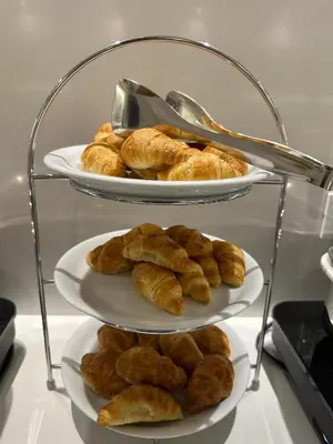 two plates of croissants and other pastries on a shelf at Hotel Galaxias in Rhodes Town
