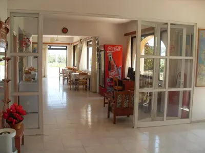 a restaurant with a dining area with tables and chairs at Vera Studios in Faliraki