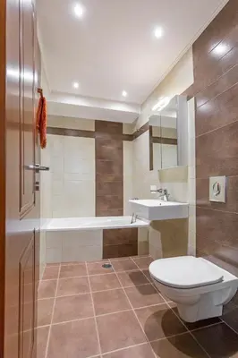 a bathroom with a toilet and a sink and a tub at Central Luxurious Apartments Close to the Sea in Rhodes Town