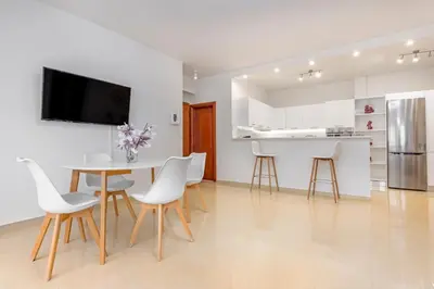 a kitchen and dining room with a table and chairs at Central Luxurious Apartments Close to the Sea in Rhodes Town
