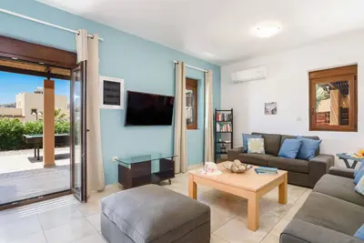 a living room with a couch and a table at Villa Ophelia in Líndos