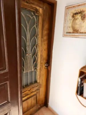 a wooden door with a window in a room at Lindos Boutique - Adults Only in Líndos