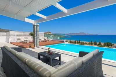 a villa with a swimming pool and a patio at Villa Hermes with pool & jacuzzi in Lindos in Líndos