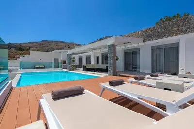 a villa with a swimming pool and a house at Villa Hermes with pool & jacuzzi in Lindos in Líndos