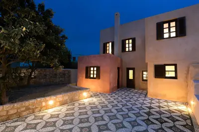 an exterior view of a house with lights at Tafros Villa in Rhodes Town