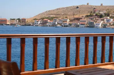 a view of a body of water with houses and buildings at Villa Amalia in Halki