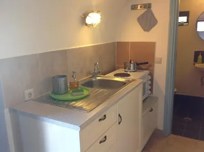 a small kitchen with a sink and a counter at Villa Amalia in Halki