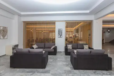 a living room with two couches at BELVITA Hotel in Kolimbia