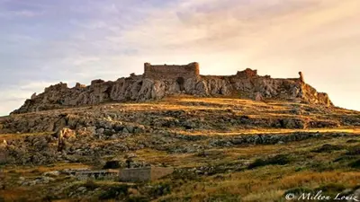 a castle on top of a rocky mountain at Haraki Blue Pearl in Haraki