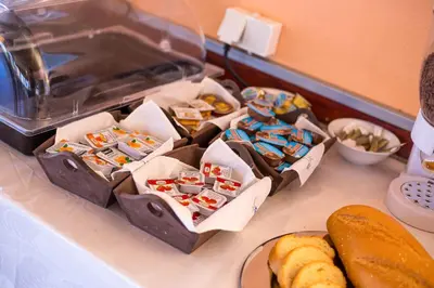 a counter with several boxes of food on a table at Marieta-Giannis in Faliraki