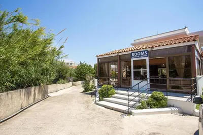 a house with a sign on the front of it at Marieta-Giannis in Faliraki