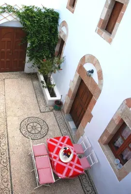 an overhead view of a patio with a table and chairs at Casa Lindos in Líndos