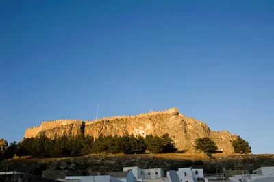 a mountain with houses in front of it at Casa Lindos in Líndos