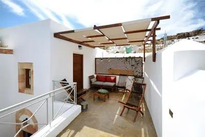 a view from the balcony of a house with a roof at Casa Lindos in Líndos