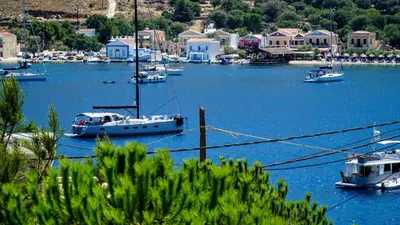 a group of boats are docked in a harbor at Irene Double Apartment Katoi in Symi