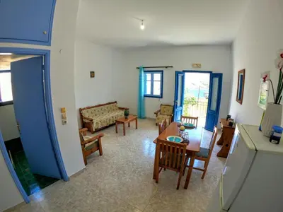 a living room with a couch and a table at Irene Double Apartment Katoi in Symi