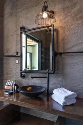 a bathroom with a sink and a mirror at amara luxury villas in Lachania