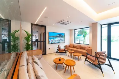 a living room with a couch and a table at Hippocampus Boutique Hotel in Ixia
