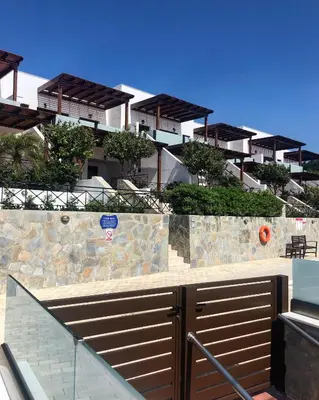 a view of a building with a gate and stairs at Southern Dreams Apartments in Gennadi