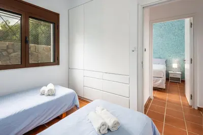 a room with two beds and a window at Southern Dreams Apartments in Gennadi