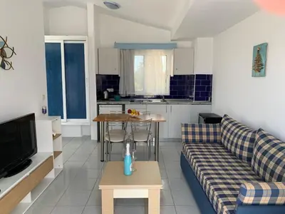 a living room with a couch and a table at Christiana Hotel Apartments in Gennadi