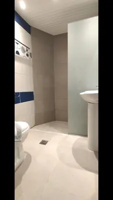 a bathroom with a toilet and a sink at Christiana Hotel Apartments in Gennadi
