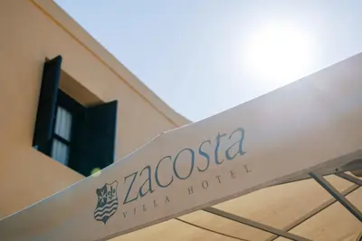 a sign that reads zacoscidated in front of a building at Zacosta Villa - a Heritage Hotel in Rhodes Town
