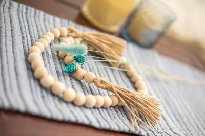 a group of wooden beads on a table at Anna's House Traditional in Halki