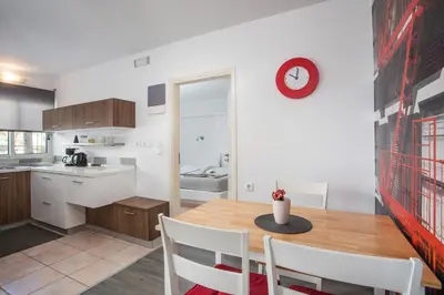 a kitchen and dining room with a table and chairs at Sabrina Studios in Faliraki