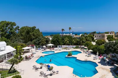 an aerial view of a resort with a pool at Happy Days Hotel, Adults Only in Theologos