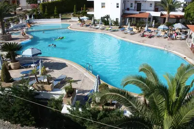 an overhead view of a swimming pool in a resort at Coliseum Studios & Apartments in Pefki Rhodes