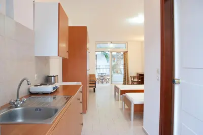a kitchen with a sink and a counter top at Coliseum Studios & Apartments in Pefki Rhodes