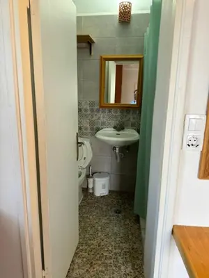 a bathroom with a sink and a toilet at Lindos Marianthi Studios in Líndos