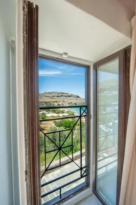 a window in a room with a view at Lindos Marianthi Studios in Líndos