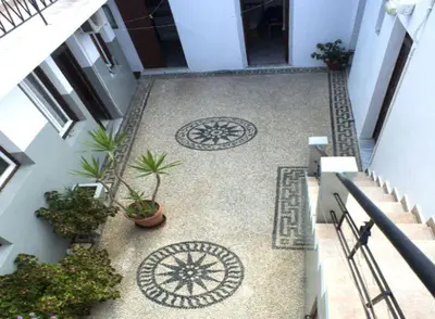 an overhead view of a staircase with plants and tiles at Lindos Marianthi Studios in Líndos