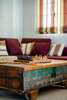 a coffee table with a chess board on top at Blue Wave Villa in Gennadi