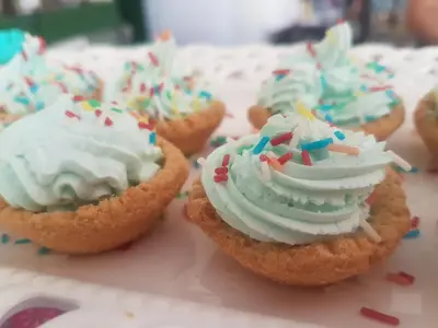 a group of cupcakes with white frosting and sprinkles at Anelia Boutique Studios & Apartments in Faliraki
