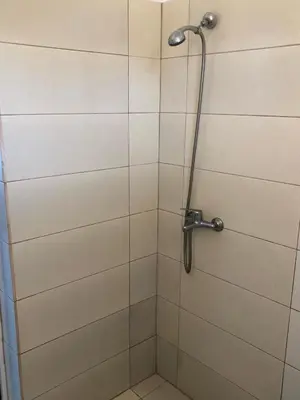 a shower in a bathroom with a glass door at Kedros Rooms in Prasonisi