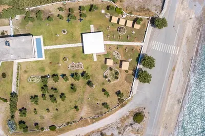 an aerial view of a yard with trees at Al Mare Apartments in Afantou
