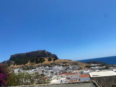 a view of a town on top of a hill at Villa Valasia Lindos with Acropolis View in Líndos