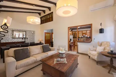 a living room with a couch and a table at Una Villa Rhodes in Ixia